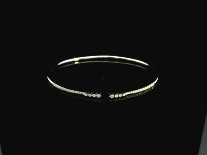 18K white gold diamond bangle featuring 0.54 carat natural diamonds in an elegant open bangle design.