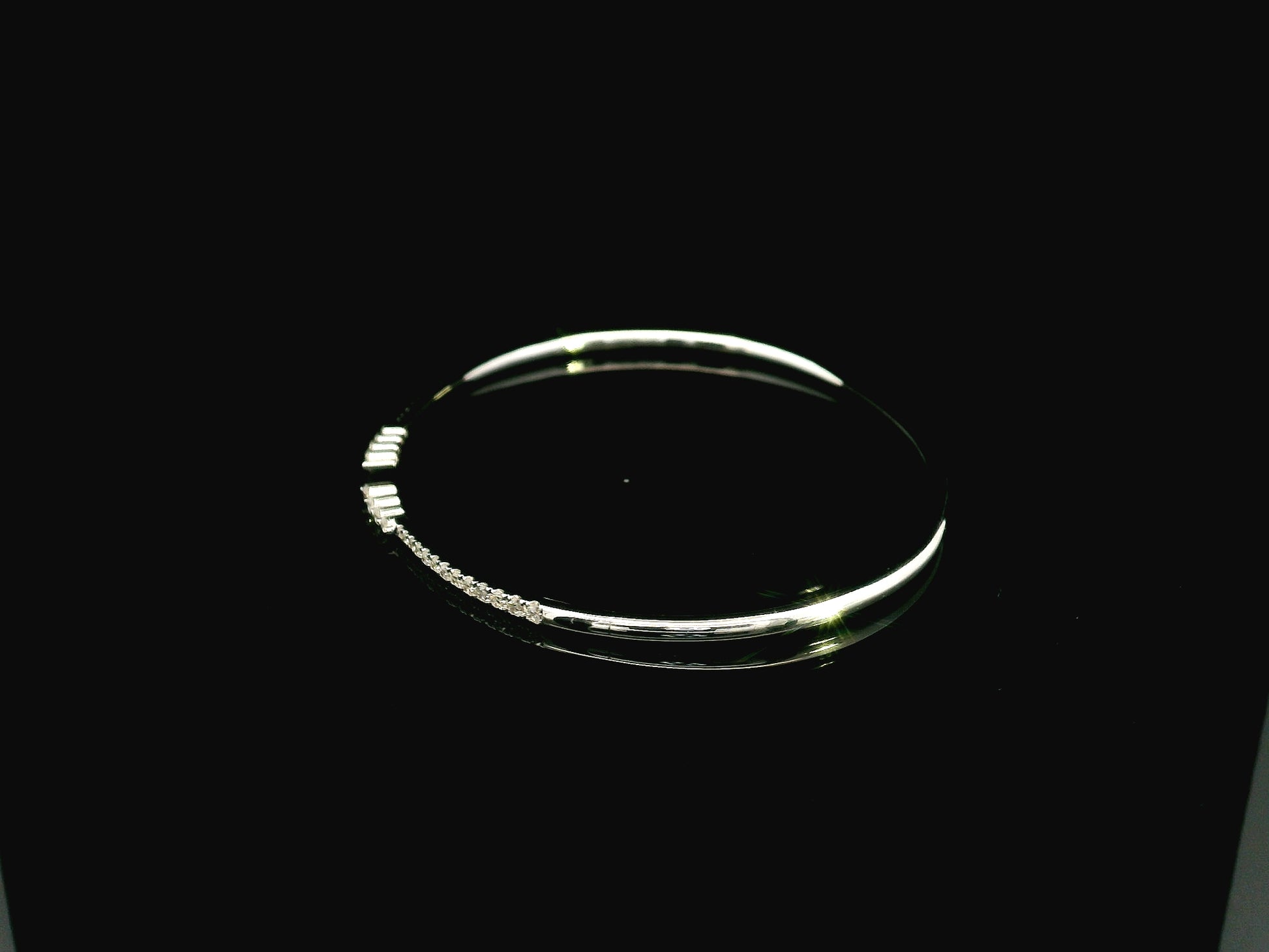 18K white gold diamond bangle featuring 0.54 carat natural diamonds in an elegant open bangle design.