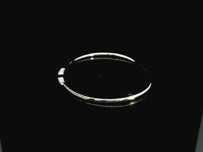 18K white gold diamond bangle featuring 0.54 carat natural diamonds in an elegant open bangle design.