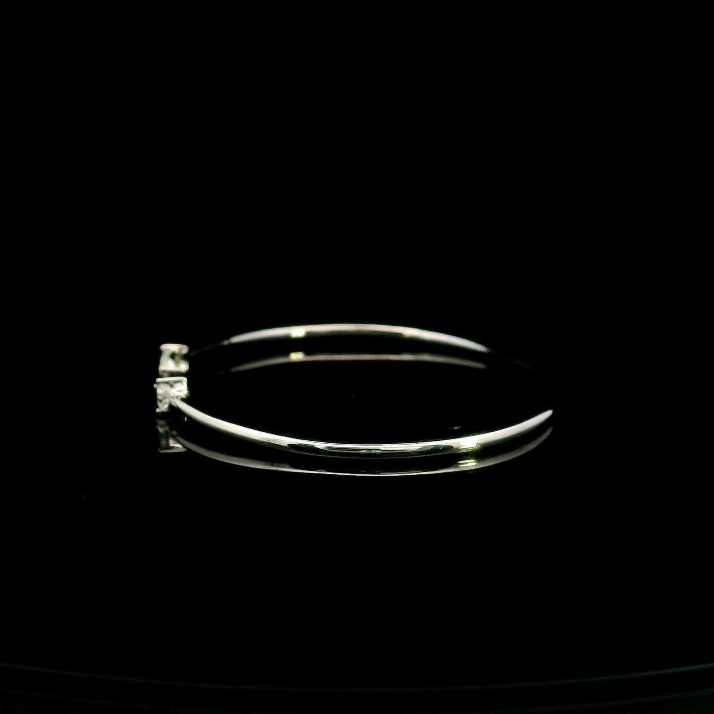 18K white gold open cuff bangle featuring pear-shaped natural diamonds with a total diamond weight of 0.61 Carat.