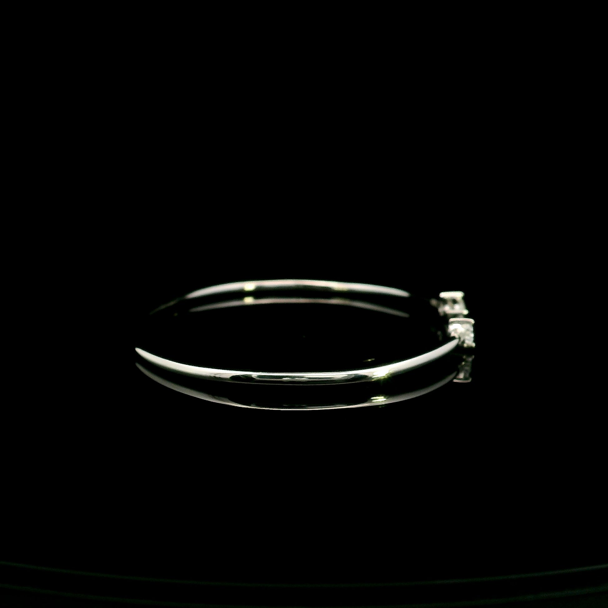 18K white gold open cuff bangle featuring pear-shaped natural diamonds with a total diamond weight of 0.61 Carat.