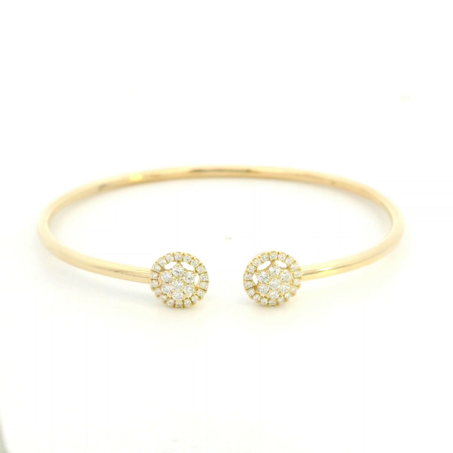 18K yellow gold open cuff bangle with two round natural diamond cluster ends.