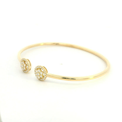 18K yellow gold open cuff bangle with two round natural diamond cluster ends.