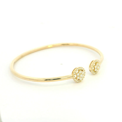 18K yellow gold open cuff bangle with two round natural diamond cluster ends.
