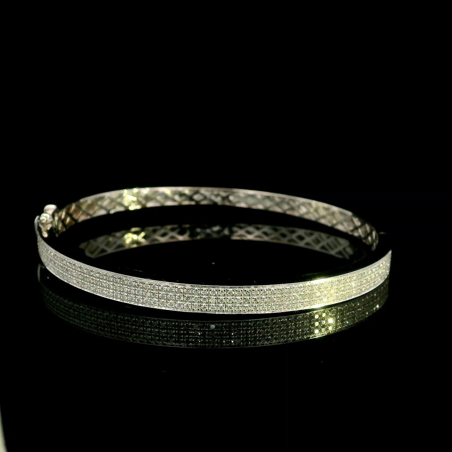 18K white gold multi-row diamond bangle set with 1.45 carats of natural round diamonds.