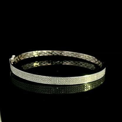 18K white gold multi-row diamond bangle set with 1.45 carats of natural round diamonds.