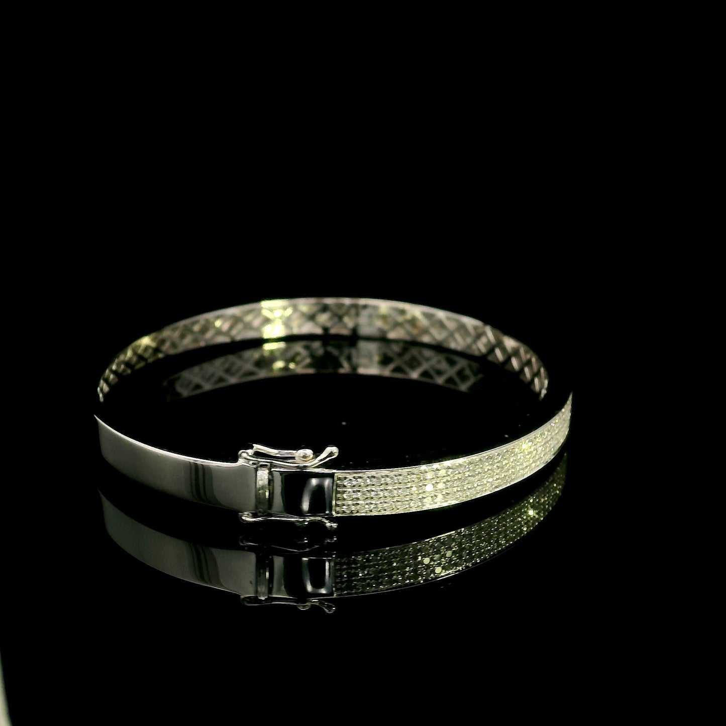 18K white gold multi-row diamond bangle set with 1.45 carats of natural round diamonds.