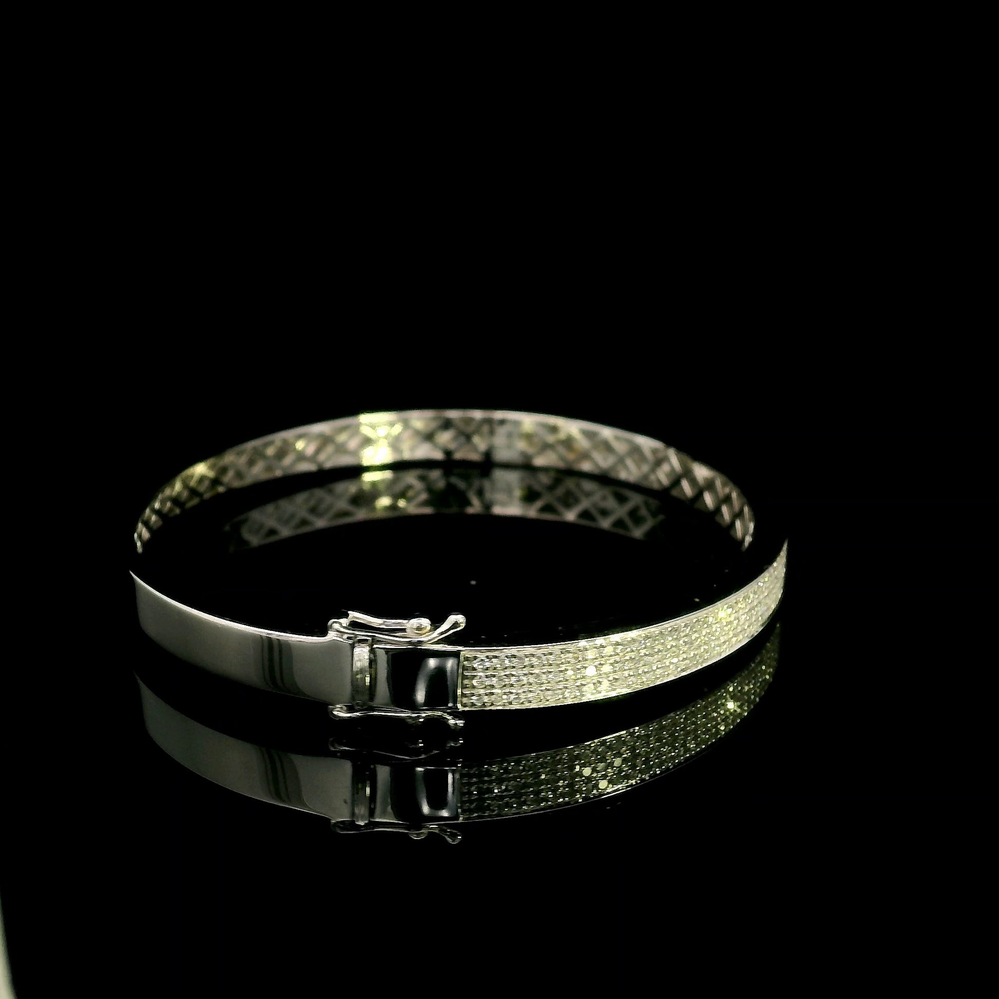 18K white gold multi-row diamond bangle set with 1.45 carats of natural round diamonds.