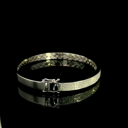 18K white gold multi-row diamond bangle set with 1.45 carats of natural round diamonds.