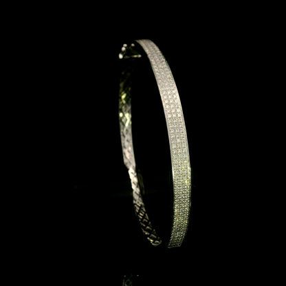 18K white gold multi-row diamond bangle set with 1.45 carats of natural round diamonds.