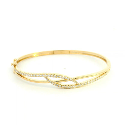 18K yellow gold diamond crossover bangle with 0.80 carat round brilliant natural diamonds and intertwined polished gold design