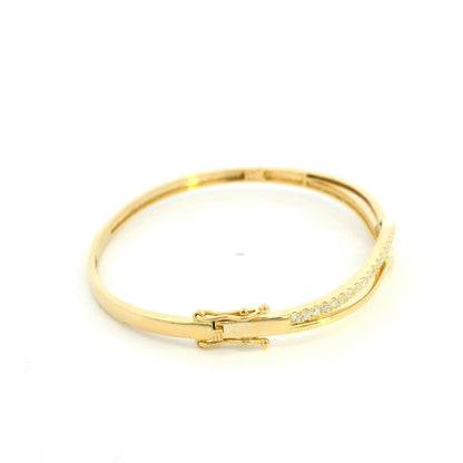 18K yellow gold diamond crossover bangle with 0.80 carat round brilliant natural diamonds and intertwined polished gold design