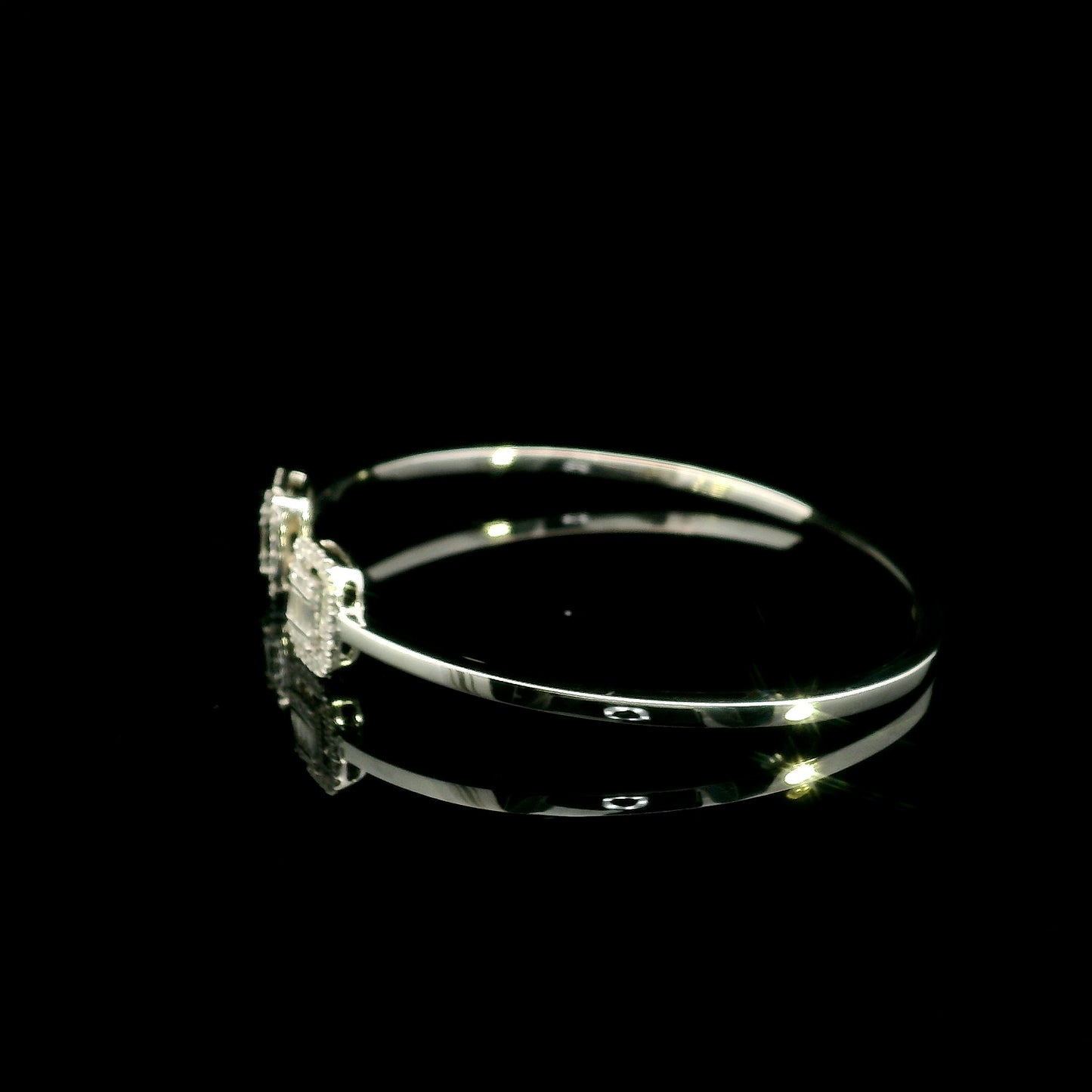 18K white gold open diamond bangle with round brilliant and baguette cut diamonds in matching square geometric ends