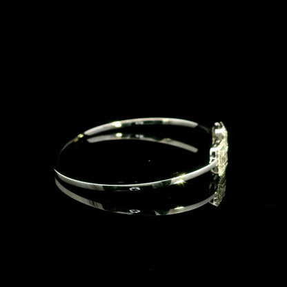 18K white gold open diamond bangle with round brilliant and baguette cut diamonds in matching square geometric ends