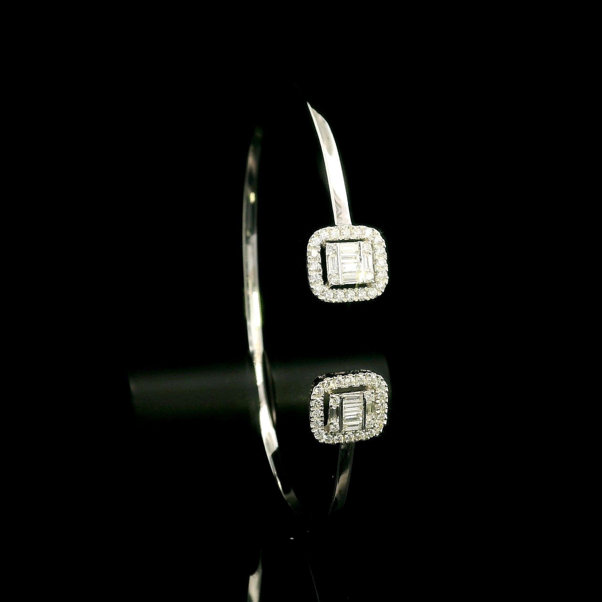 18K white gold open diamond bangle with round brilliant and baguette cut diamonds in matching square geometric ends