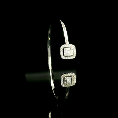 18K white gold open diamond bangle with round brilliant and baguette cut diamonds in matching square geometric ends