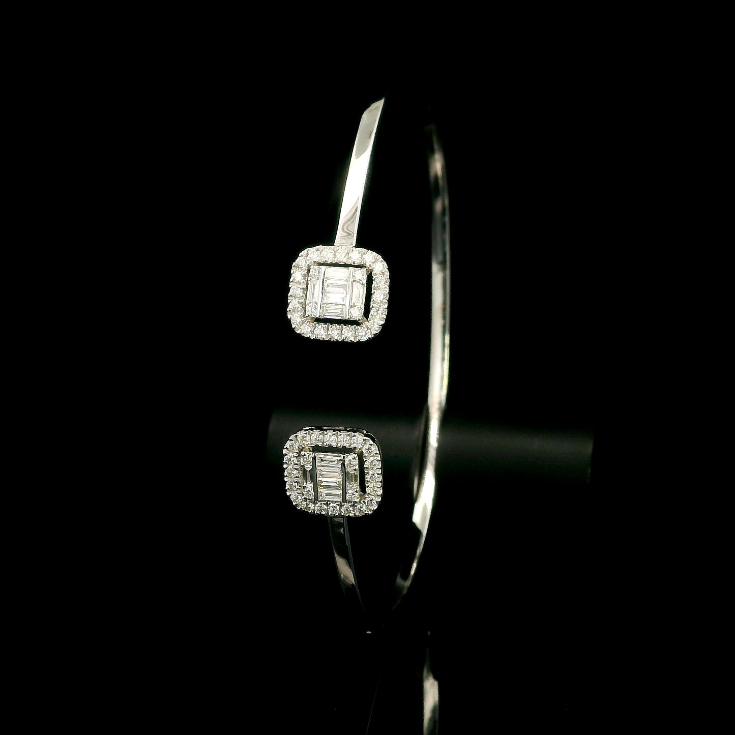 18K white gold open diamond bangle with round brilliant and baguette cut diamonds in matching square geometric ends