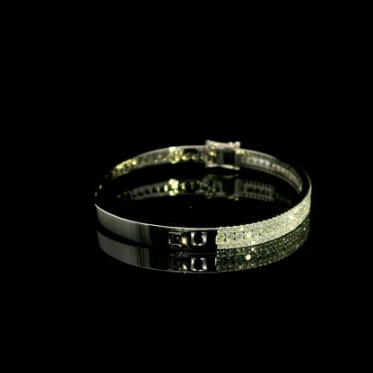 Three row diamond bangle in 18K white gold with parallel rows of round diamonds across the front.