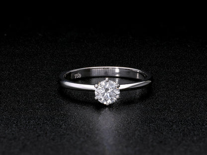Round brilliant cut diamond solitaire engagement ring in 18K white gold featuring a 0.50 carat natural diamond in a six-prong setting on a slim polished band.