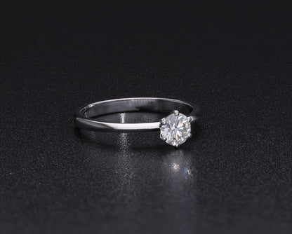 Round brilliant cut diamond solitaire engagement ring in 18K white gold featuring a 0.50 carat natural diamond in a six-prong setting on a slim polished band.
