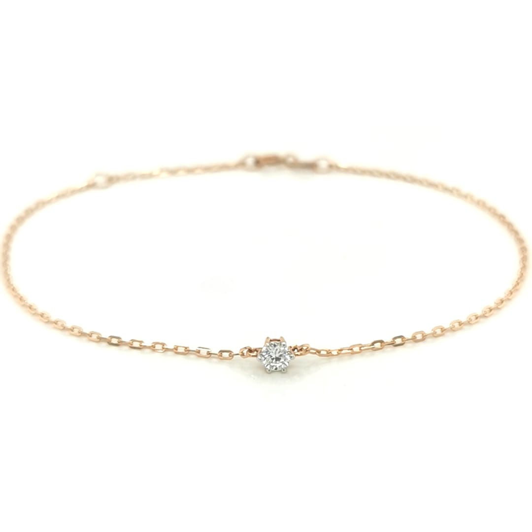 This Solitaire Diamond Bracelet, crafted from 18k Yellow Gold, is the perfect way to add a subtle sparkle to your wrist. The minimalist design features a single diamond, allowing you to make a subtle yet elegant statement.
