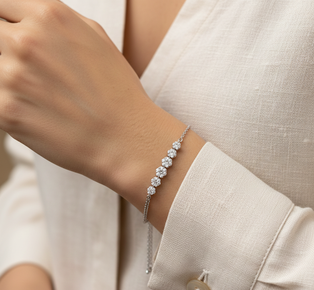 Diamond floral cluster bracelet in 18K white gold with 0.55 carat total diamond weight by Emirates Diamonds