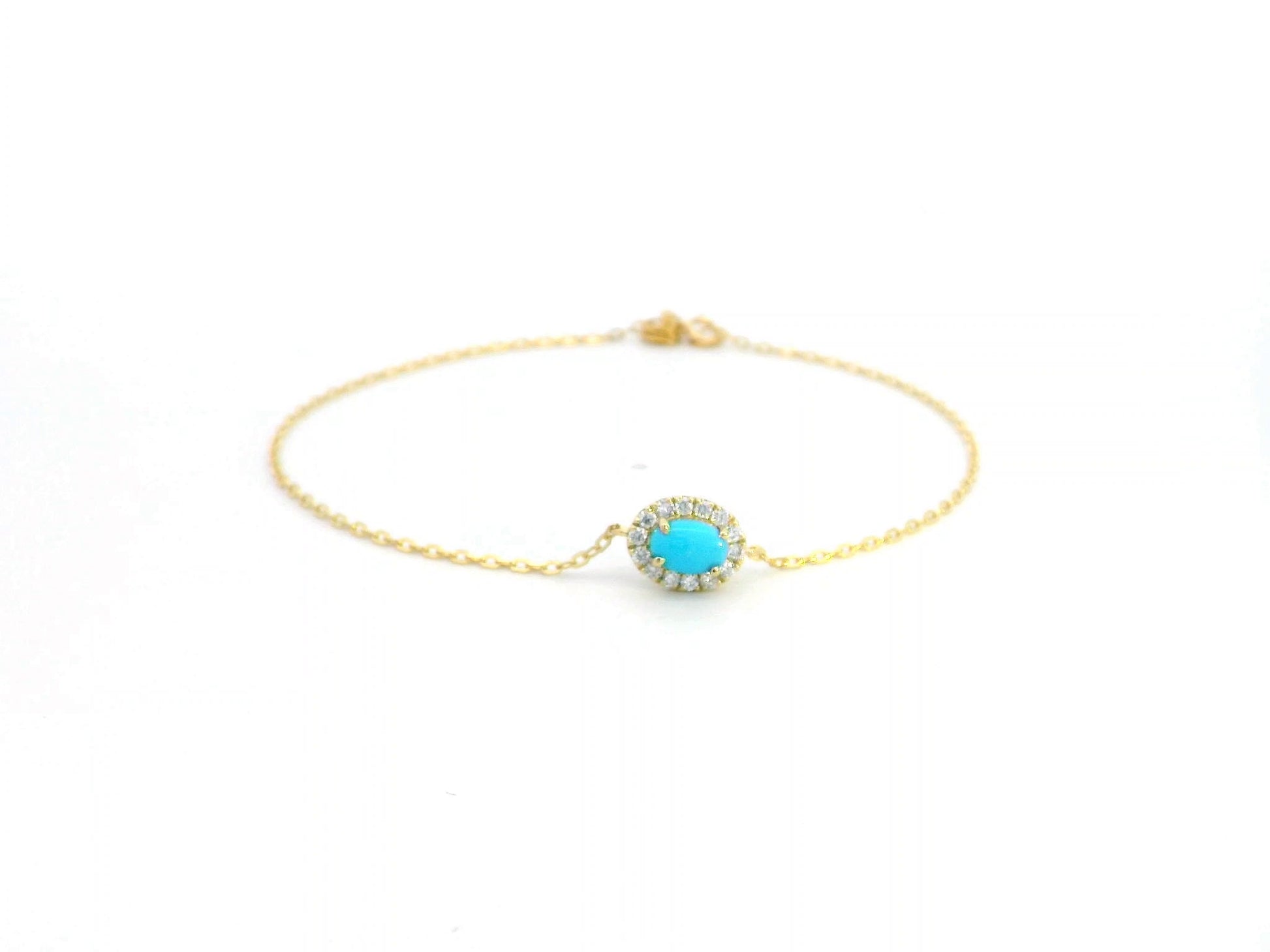 18K gold bracelet with a 0.54-carat turquoise gemstone surrounded by a 0.16-carat diamond halo on a delicate gold chain