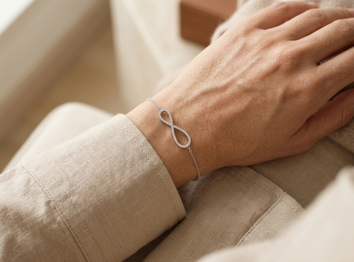 18K white gold diamond infinity bracelet with pavé-set natural diamonds.