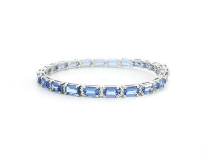 18K white gold tennis bracelet with emerald-cut tanzanites and diamond accents