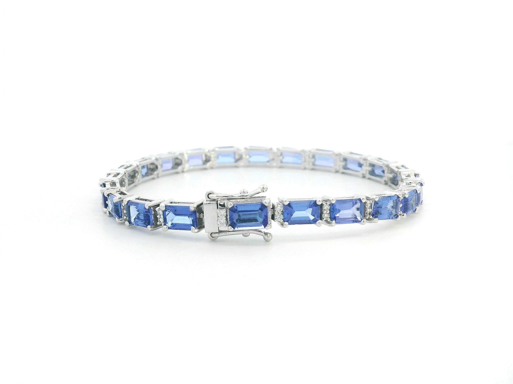 Close-up of tanzanite tennis bracelet with secure clasp detail