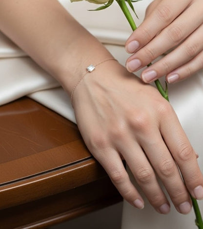 Minimalist diamond bracelet with rectangular setting in 18K yellow gold by Emirates Diamonds