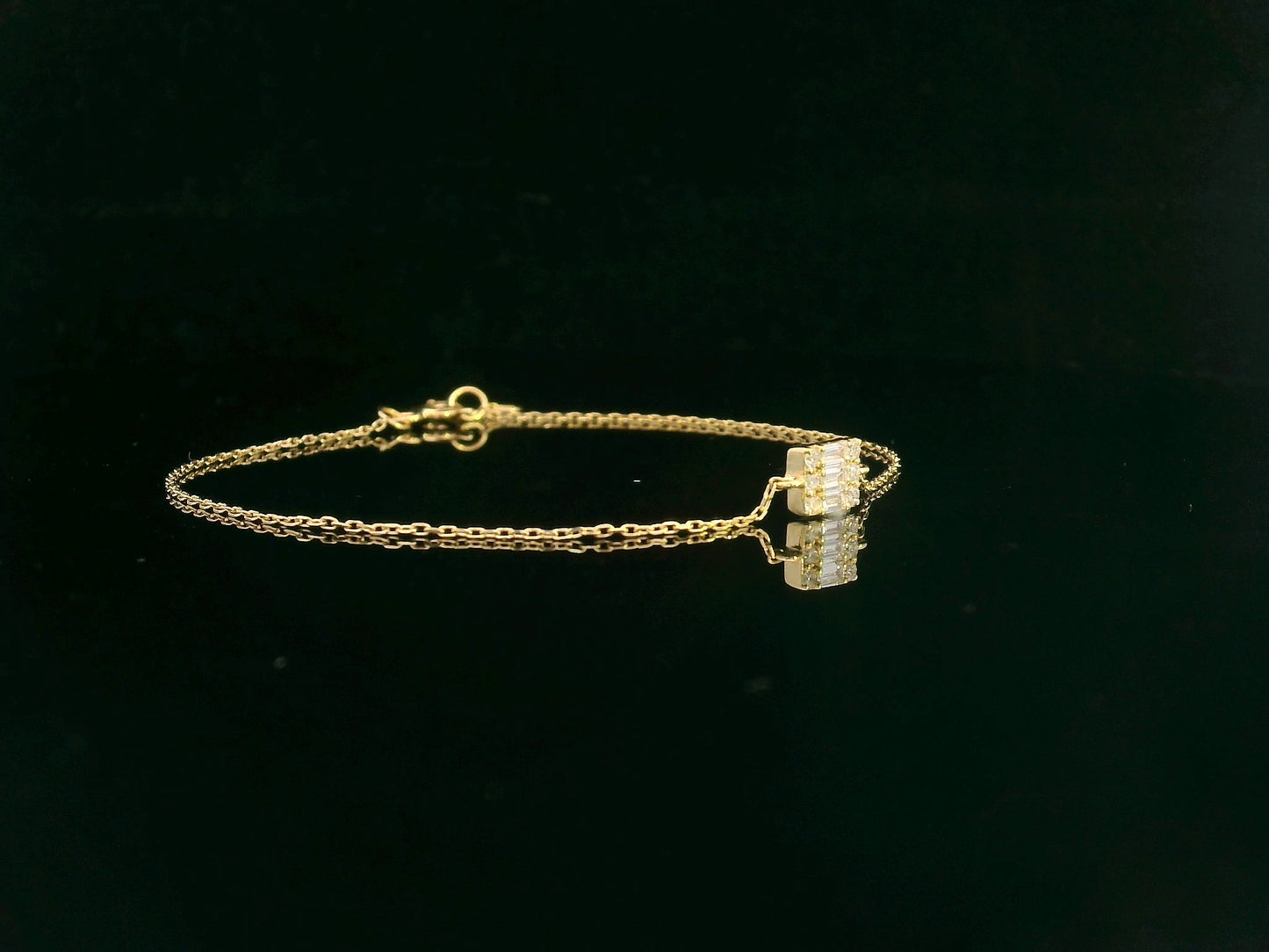 Minimalist diamond bracelet with rectangular setting in 18K yellow gold by Emirates Diamonds