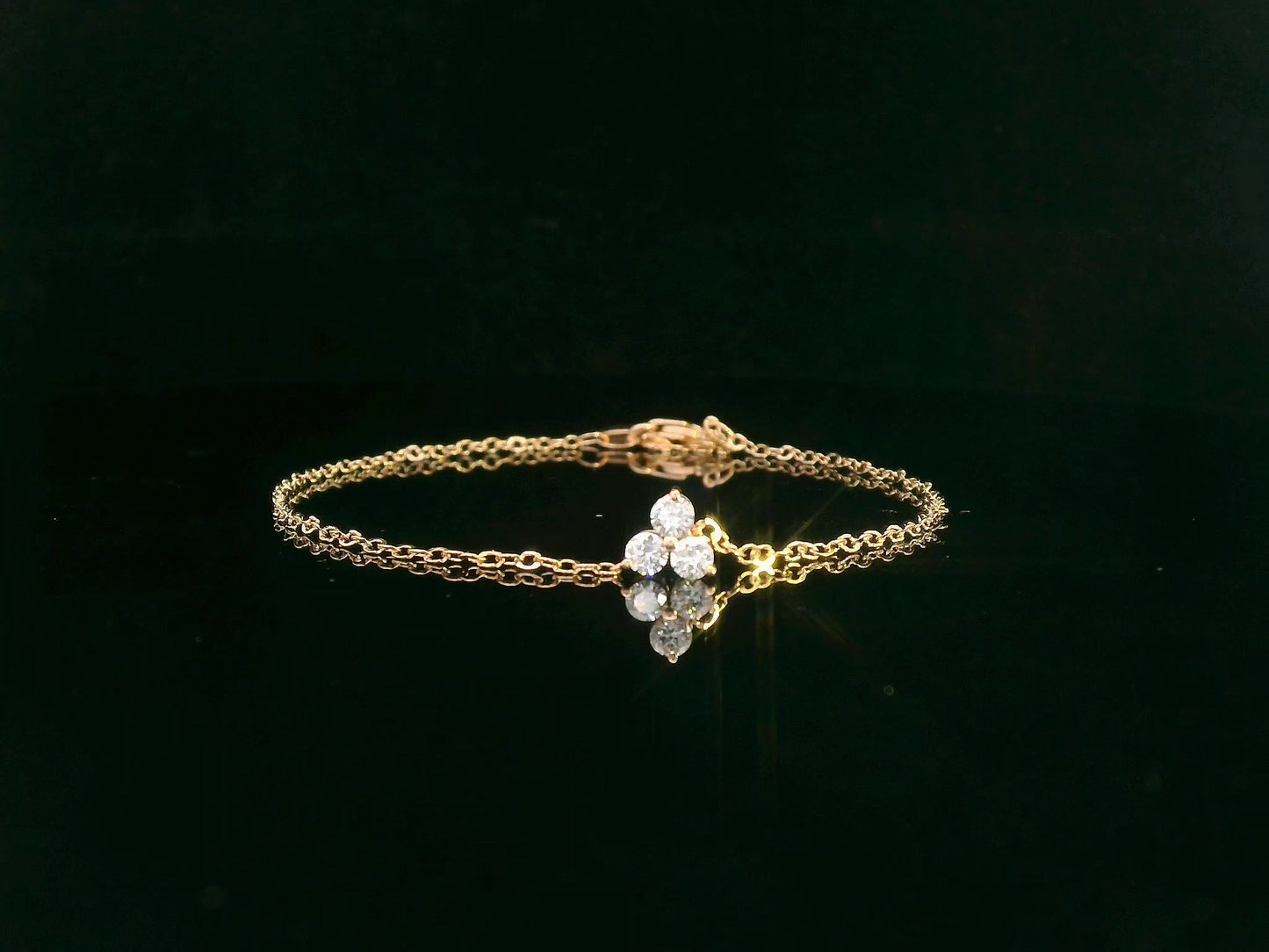 18K yellow gold chain bracelet with three round-cut diamond charm in triangular pattern – Emirates Diamonds