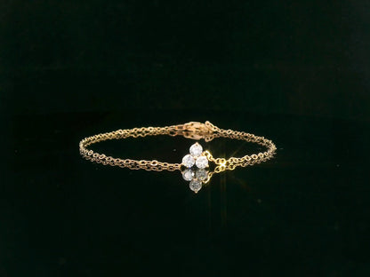 18K yellow gold chain bracelet with three round-cut diamond charm in triangular pattern – Emirates Diamonds