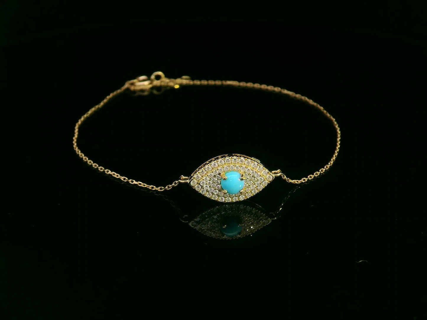 18K yellow gold turquoise and diamond evil eye bracelet – pavé diamond halo with turquoise center by Emirates Diamonds.