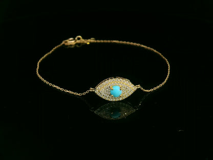 18K yellow gold turquoise and diamond evil eye bracelet – pavé diamond halo with turquoise center by Emirates Diamonds.