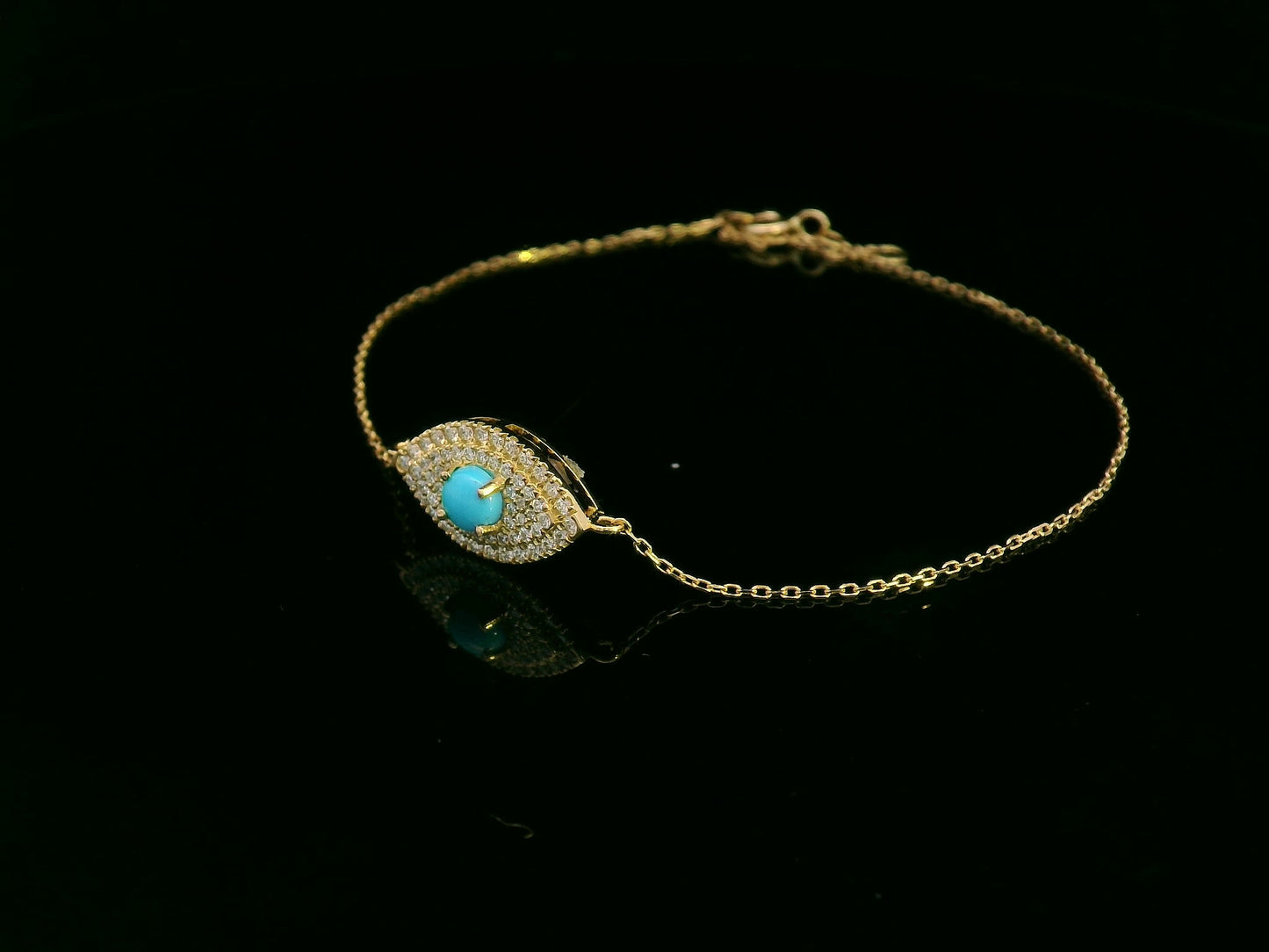 18K yellow gold turquoise and diamond evil eye bracelet – pavé diamond halo with turquoise center by Emirates Diamonds.