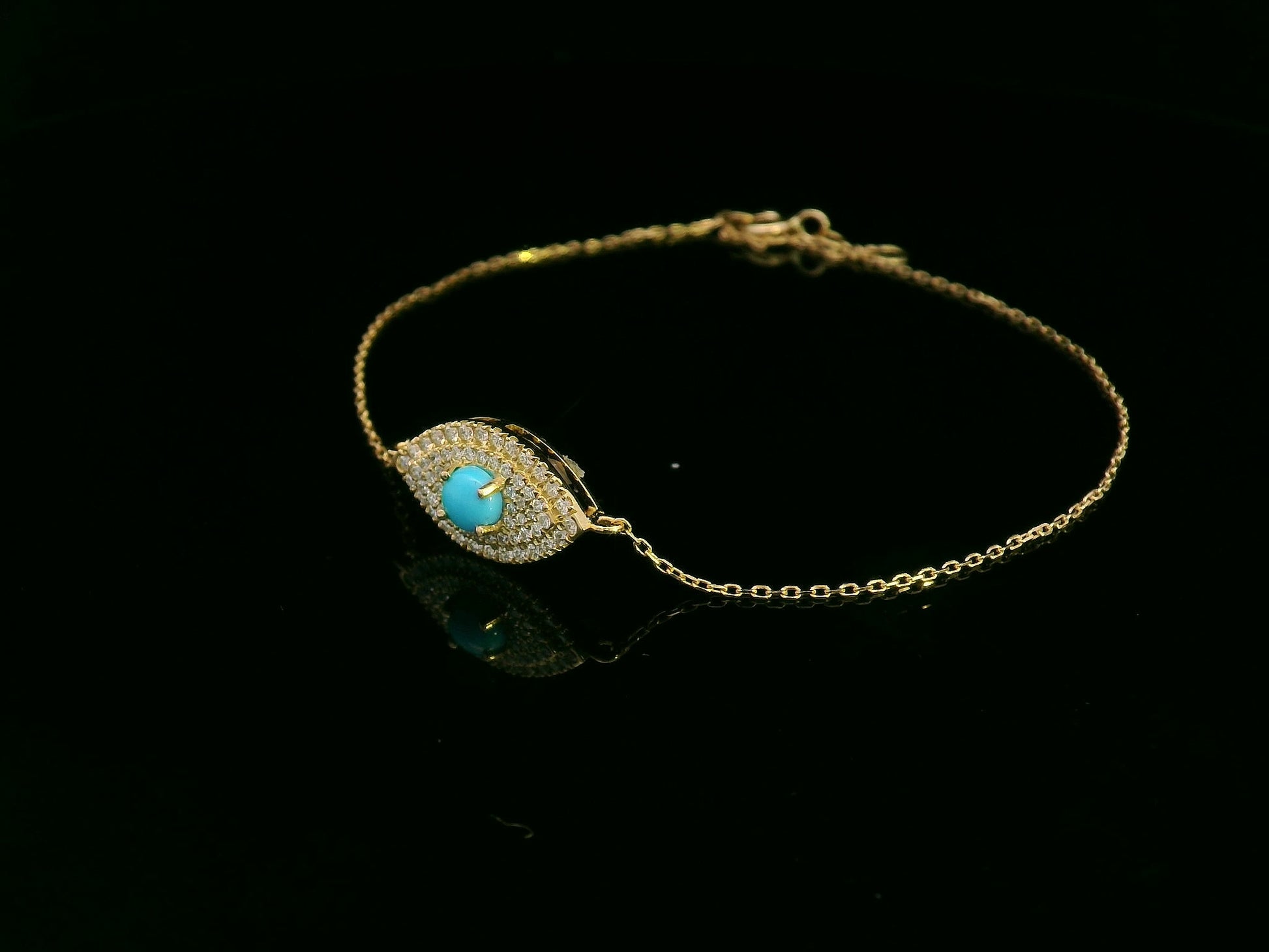 18K yellow gold turquoise and diamond evil eye bracelet – pavé diamond halo with turquoise center by Emirates Diamonds.