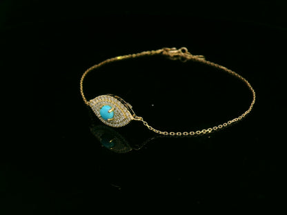 18K yellow gold turquoise and diamond evil eye bracelet – pavé diamond halo with turquoise center by Emirates Diamonds.