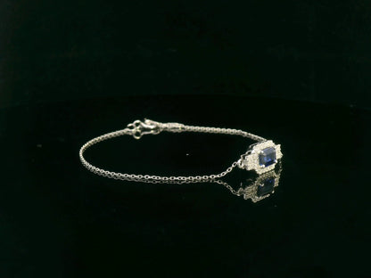 18K white gold sapphire halo bracelet with emerald-cut 0.80ct blue sapphire and diamond accents – Emirates Diamonds.