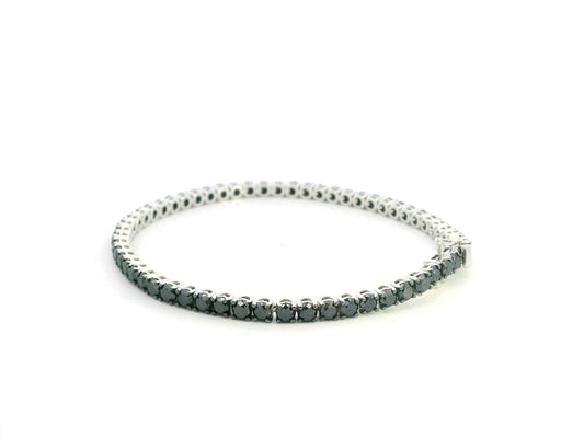 18K white gold tennis bracelet featuring 8.51 carats of natural black diamonds by Emirates Diamonds.