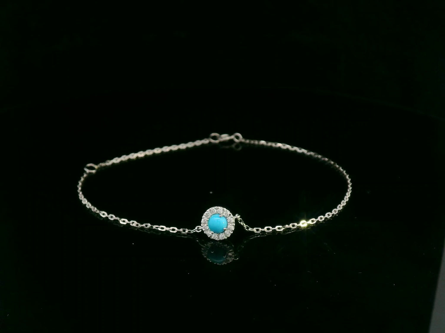 18K white gold turquoise and diamond halo bracelet featuring a 0.28 carat turquoise and 0.11 carat diamonds by Emirates Diamonds