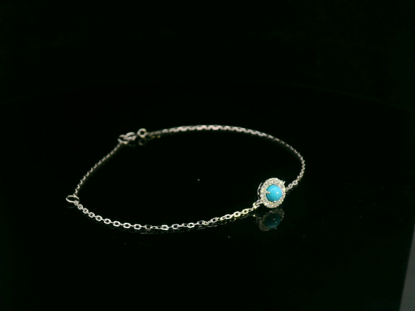 18K white gold turquoise and diamond halo bracelet featuring a 0.28 carat turquoise and 0.11 carat diamonds by Emirates Diamonds