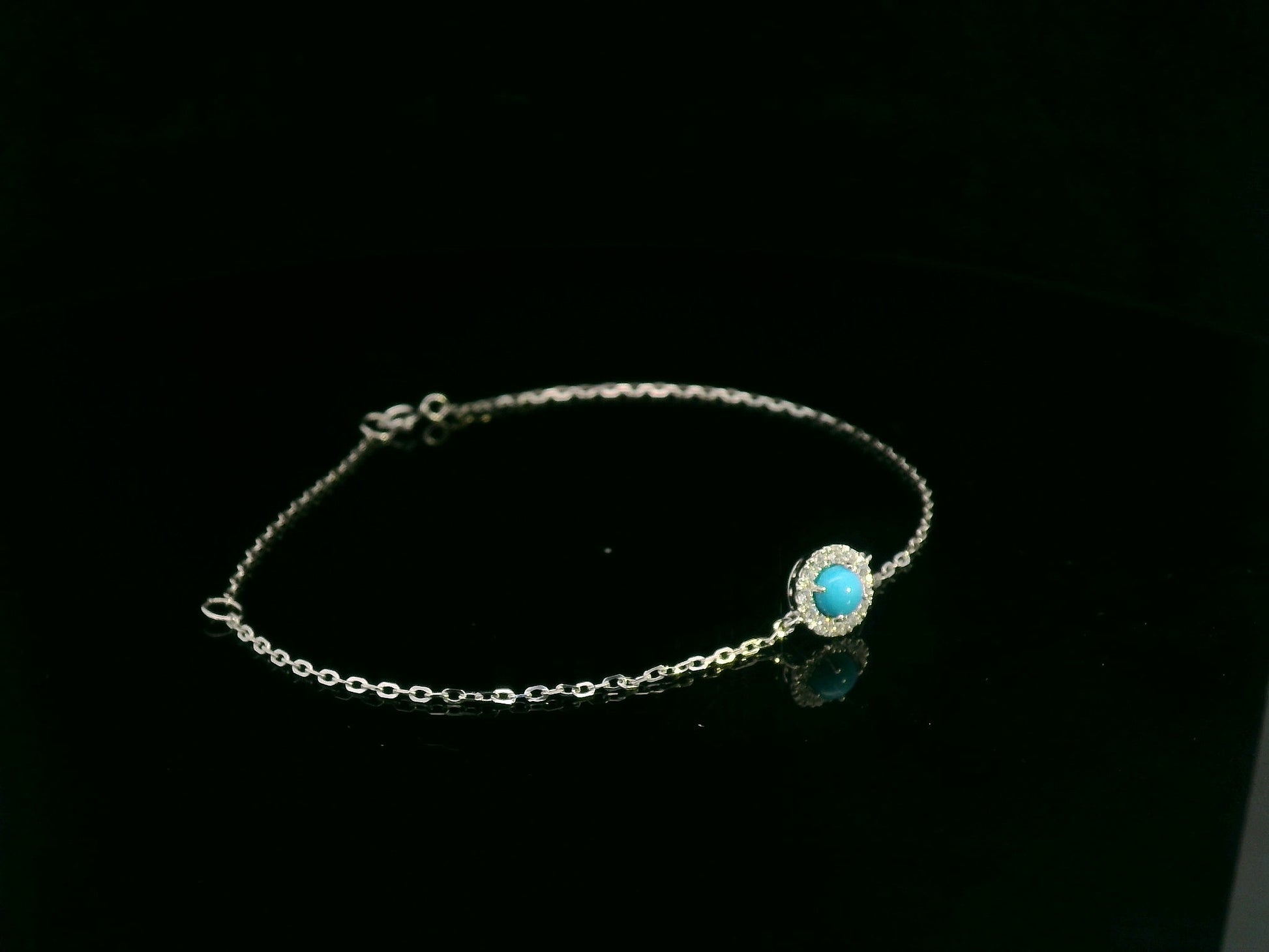 18K white gold turquoise and diamond halo bracelet featuring a 0.28 carat turquoise and 0.11 carat diamonds by Emirates Diamonds