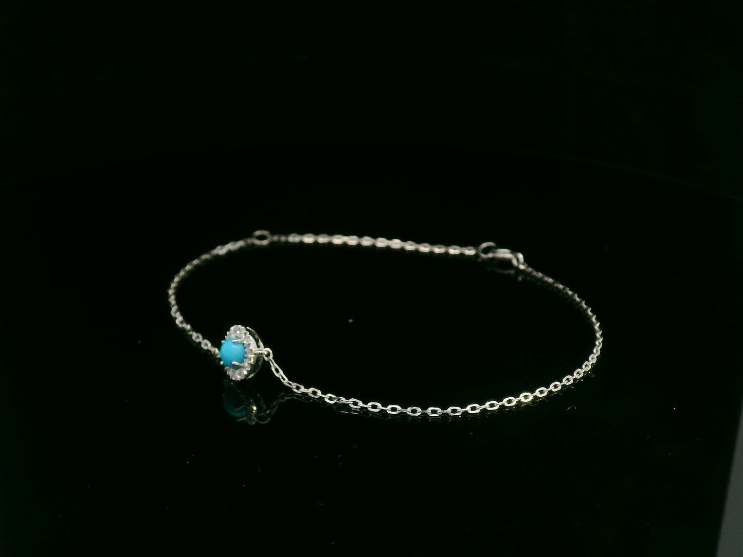 18K white gold turquoise and diamond halo bracelet featuring a 0.28 carat turquoise and 0.11 carat diamonds by Emirates Diamonds