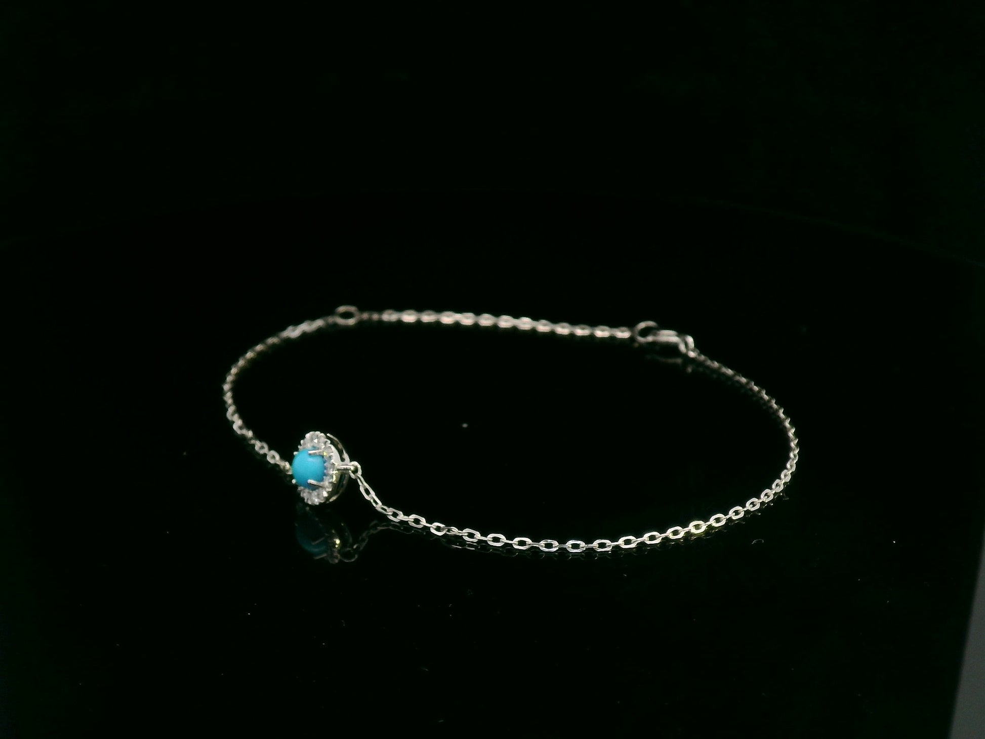 18K white gold turquoise and diamond halo bracelet featuring a 0.28 carat turquoise and 0.11 carat diamonds by Emirates Diamonds