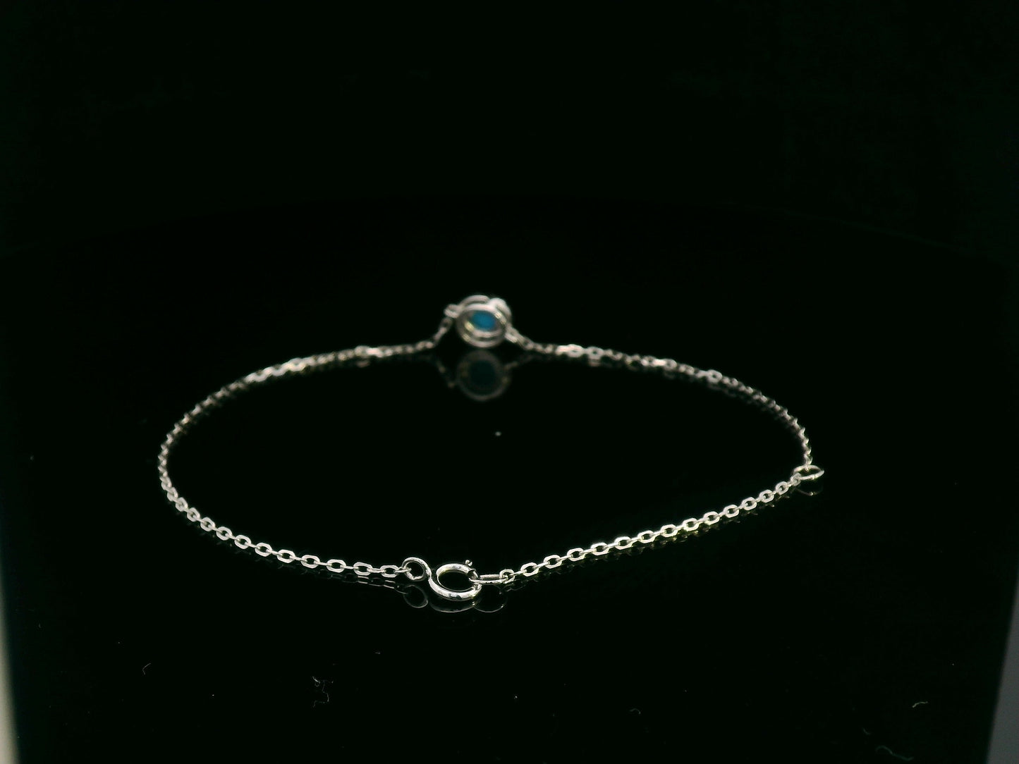 18K white gold turquoise and diamond halo bracelet featuring a 0.28 carat turquoise and 0.11 carat diamonds by Emirates Diamonds