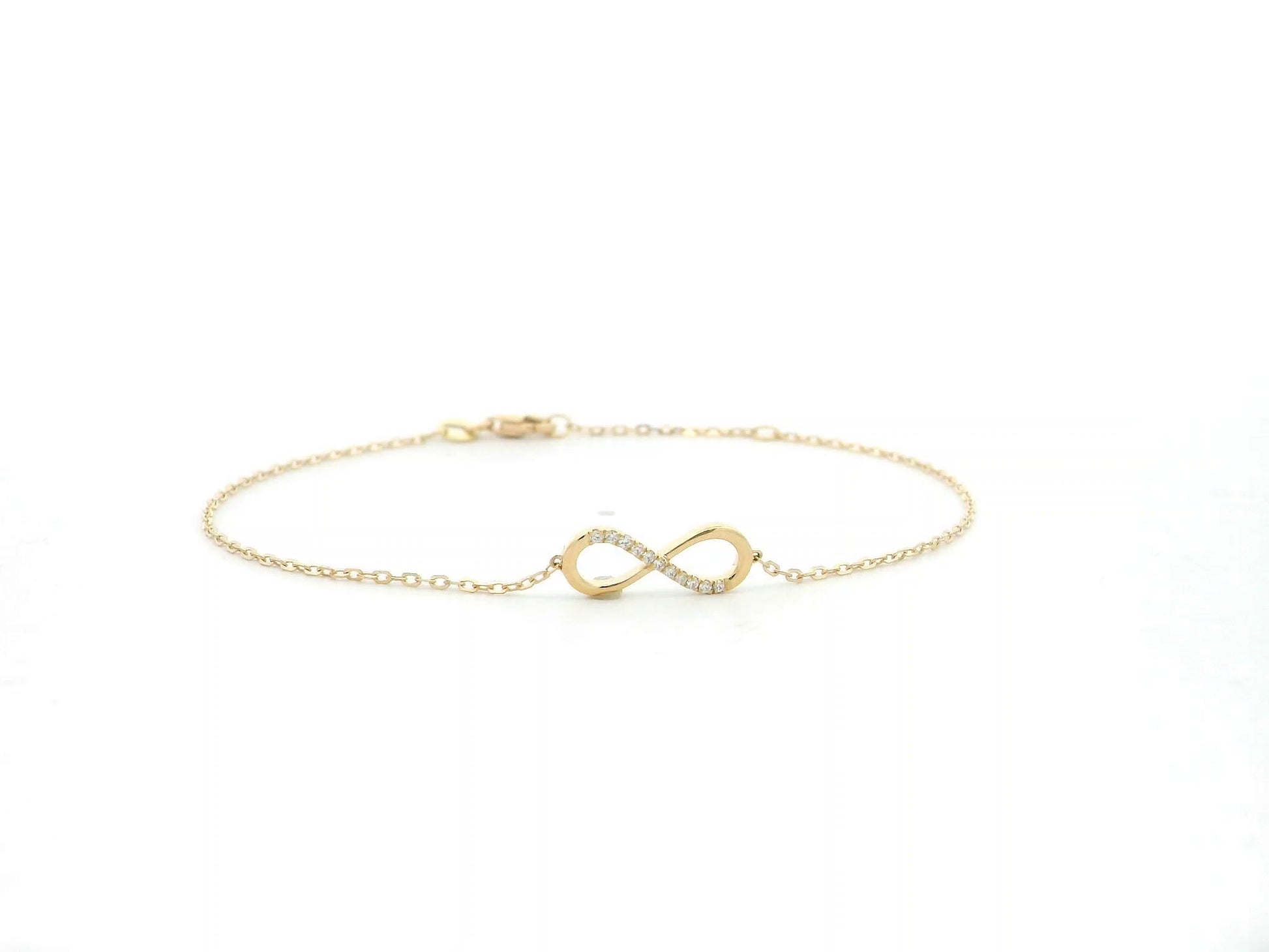 Diamond infinity bracelet in 18K yellow gold with 0.05 carat natural diamonds by Emirates Diamonds.