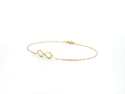 Diamond infinity bracelet in 18K yellow gold with 0.05 carat natural diamonds by Emirates Diamonds.