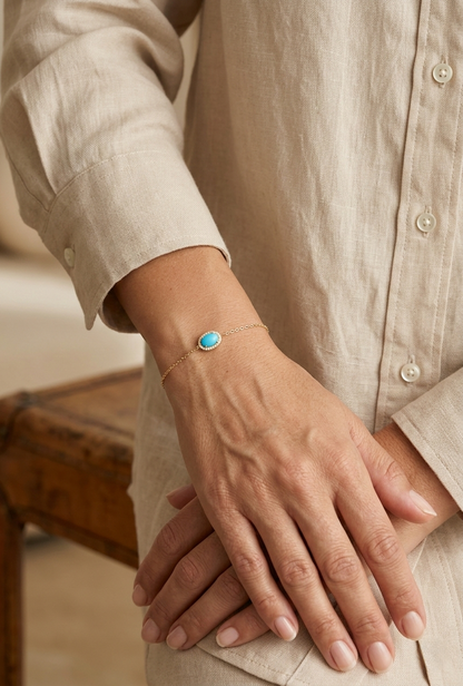 Turquoise diamond halo bracelet in 18K yellow gold with delicate chain by Emirates Diamonds